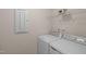 Bright laundry room features a washer, dryer, and wire shelving at 232 Kanewind Ter, Apex, NC 27523