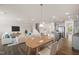 Staged open concept living room with dining area and kitchen at 232 Kanewind Ter, Apex, NC 27523