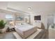 Spacious main bedroom with tray ceiling and natural light at 232 Kanewind Ter, Apex, NC 27523