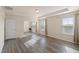 Bright main bedroom featuring hardwood floors, neutral paint and natural light at 232 Kanewind Ter, Apex, NC 27523
