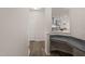 Hallway office nook with desk and granite countertop at 232 Kanewind Ter, Apex, NC 27523