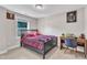 Bedroom with ample light, neutral paint, and desk space at 2501 Ferrell Rd, Durham, NC 27704