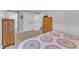 Bedroom with closet, dresser, ensuite bathroom, and plush carpeting at 2501 Ferrell Rd, Durham, NC 27704