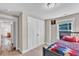 This bedroom features a built-in closet and a window for natural light at 2501 Ferrell Rd, Durham, NC 27704