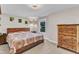 Bedroom with a wooden bed frame, patterned bedding, and hardwood furniture at 2501 Ferrell Rd, Durham, NC 27704