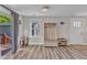 Entryway with bench seating, shoe storage, coat rack, and hardwood-style flooring at 2501 Ferrell Rd, Durham, NC 27704