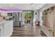Kitchen with stainless steel appliances leads to deck with outdoor seating at 2501 Ferrell Rd, Durham, NC 27704