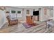 Cozy living room featuring two leather recliners, a large television, and stylish decor with gray vinyl floors at 2501 Ferrell Rd, Durham, NC 27704