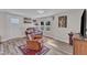 Inviting living room with wood-look flooring, modern decor, and a comfortable leather sofa and recliner set at 2501 Ferrell Rd, Durham, NC 27704