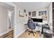 Home office space with dual monitors, neutral walls, and doorway to bathroom at 2501 Ferrell Rd, Durham, NC 27704