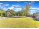 Spacious yard featuring lush lawn and mature trees surrounding this peaceful property at 2501 Ferrell Rd, Durham, NC 27704
