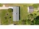 An aerial view displays the roof and yard showing its layout, detached garage, and landscaping at 2910 Dove Ln, Raleigh, NC 27604