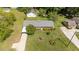 Aerial view of the house, highlighting its landscaping, driveway and detached garage at 2910 Dove Ln, Raleigh, NC 27604