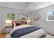 Bedroom featuring neutral walls, ceiling fan, and decorative bed at 2910 Dove Ln, Raleigh, NC 27604