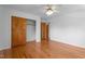 Bedroom featuring hardwood floors, closet, and doors at 2910 Dove Ln, Raleigh, NC 27604