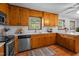 Cozy kitchen with ample cabinets and stainless steel dishwasher offer convenience and storage at 2910 Dove Ln, Raleigh, NC 27604