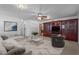 Spacious living room boasts a large sectional, custom built-ins, and a cozy atmosphere at 2910 Dove Ln, Raleigh, NC 27604