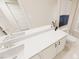 Well-lit bathroom with dual sinks and white countertops, showcasing modern design at 2917 Alyssa Ct, Knightdale, NC 27604