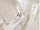 Spacious bathroom with dual sinks, white cabinets, and modern fixtures at 2917 Alyssa Ct, Knightdale, NC 27604