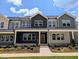 Charming townhome exterior with well-maintained landscaping and inviting curb appeal on a sunny day at 2917 Alyssa Ct, Knightdale, NC 27604