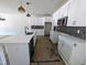 Modern kitchen featuring white cabinets, stainless steel appliances, kitchen island and pendant lighting at 2917 Alyssa Ct, Knightdale, NC 27604