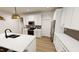 Well-lit kitchen with an island, stainless steel appliances, and white cabinetry at 2917 Alyssa Ct, Knightdale, NC 27604