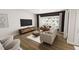Cozy living area with a comfortable sofa, modern furniture, and large windows at 2917 Alyssa Ct, Knightdale, NC 27604