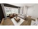 Bright living room with modern furniture, a neutral color scheme, and large windows at 2917 Alyssa Ct, Knightdale, NC 27604