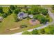 Aerial view showcasing the home's backyard with a deck, garden and an outdoor structure at 303 Crooked Meadow Ln, Hillsborough, NC 27278