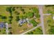 Overhead shot of house with verdant landscaping, a private driveway, garden and lush trees at 303 Crooked Meadow Ln, Hillsborough, NC 27278