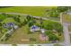 Beautiful aerial view of home with solar panels surrounded by green landscape, showing its location at 303 Crooked Meadow Ln, Hillsborough, NC 27278