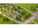 Overhead view of a house on a spacious lot, with a garden, a deck and lush green surroundings at 303 Crooked Meadow Ln, Hillsborough, NC 27278