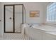 Bright bathroom with a walk-in shower and soaking tub with tile surround at 303 Crooked Meadow Ln, Hillsborough, NC 27278