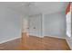A bright bedroom offers wood floors and a double door closet at 303 Crooked Meadow Ln, Hillsborough, NC 27278