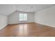 Empty bonus room offers wood floors and a dormer window at 303 Crooked Meadow Ln, Hillsborough, NC 27278