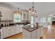 Updated kitchen with granite countertops, stainless steel appliances, and tile backsplash at 303 Crooked Meadow Ln, Hillsborough, NC 27278