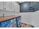 Well-equipped laundry room featuring modern appliances, ample storage, and stylish design elements at 303 Crooked Meadow Ln, Hillsborough, NC 27278