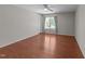 Bedroom features hardwood floors, natural lighting, and curtained windows at 3069 Buttonwood Ln, Clayton, NC 27520