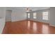 A living room with recessed lighting, ceiling fan, hardwood floors, and natural lighting at 3069 Buttonwood Ln, Clayton, NC 27520