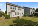 Back of home with spacious yard and patio, perfect for outdoor entertainment and relaxation at 309 Windy Peak Loop, Cary, NC 27519