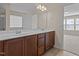 Bathroom showcases a double sink vanity and access to another bedroom space at 309 Windy Peak Loop, Cary, NC 27519
