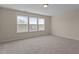 Bedroom with neutral walls and carpet, three windows offer natural light at 309 Windy Peak Loop, Cary, NC 27519