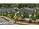 Welcome to Piazza! A community with well-maintained lawns, gardens, and sidewalks with lush greenery at 309 Windy Peak Loop, Cary, NC 27519