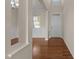 Welcoming entryway with hardwood floors and natural light streaming through the front door at 309 Windy Peak Loop, Cary, NC 27519