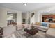 Cozy living room featuring comfortable seating, a decorative rug, and views of the dining area at 309 Windy Peak Loop, Cary, NC 27519