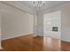 Inviting living room featuring hardwood floors and open access to a carpeted Gathering room at 309 Windy Peak Loop, Cary, NC 27519