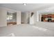 Open-concept living room with stairs, kitchen access, and a view of the dining area at 309 Windy Peak Loop, Cary, NC 27519