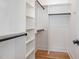 Walk-in closet featuring custom shelving and built-in storage solutions to maximize space and organization at 310 W Club Blvd, Durham, NC 27704