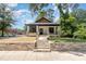 Beautiful home with a stone accented walkway, charming front porch, and well-manicured lawn at 310 W Club Blvd, Durham, NC 27704