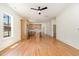 Bright living room open to the kitchen featuring hardwood floors, white walls, and recessed lighting at 310 W Club Blvd, Durham, NC 27704